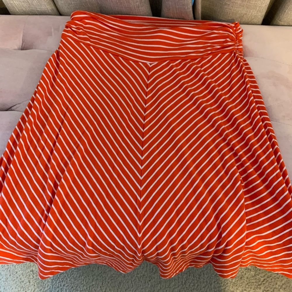 Striped orange and white skirt.